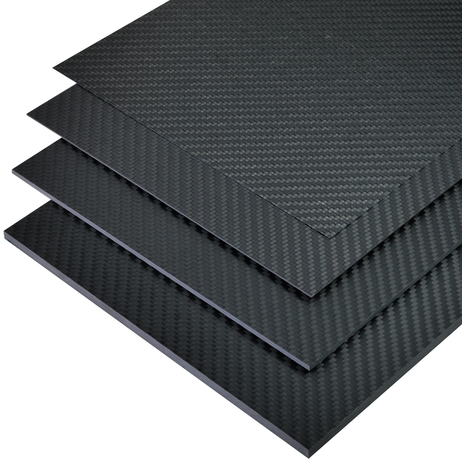 Mehrere übereinanderliegende schwarze Carbonplatten mit charakteristischer Textur.