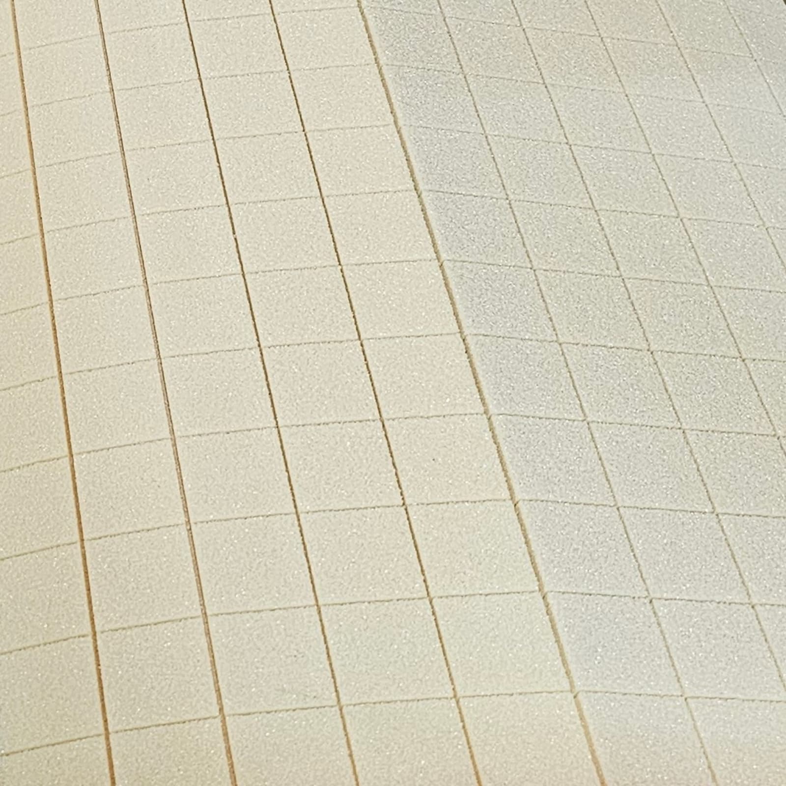 The image shows a close-up of a rigid PVC foam sheet with grooves that form a uniform grid pattern.