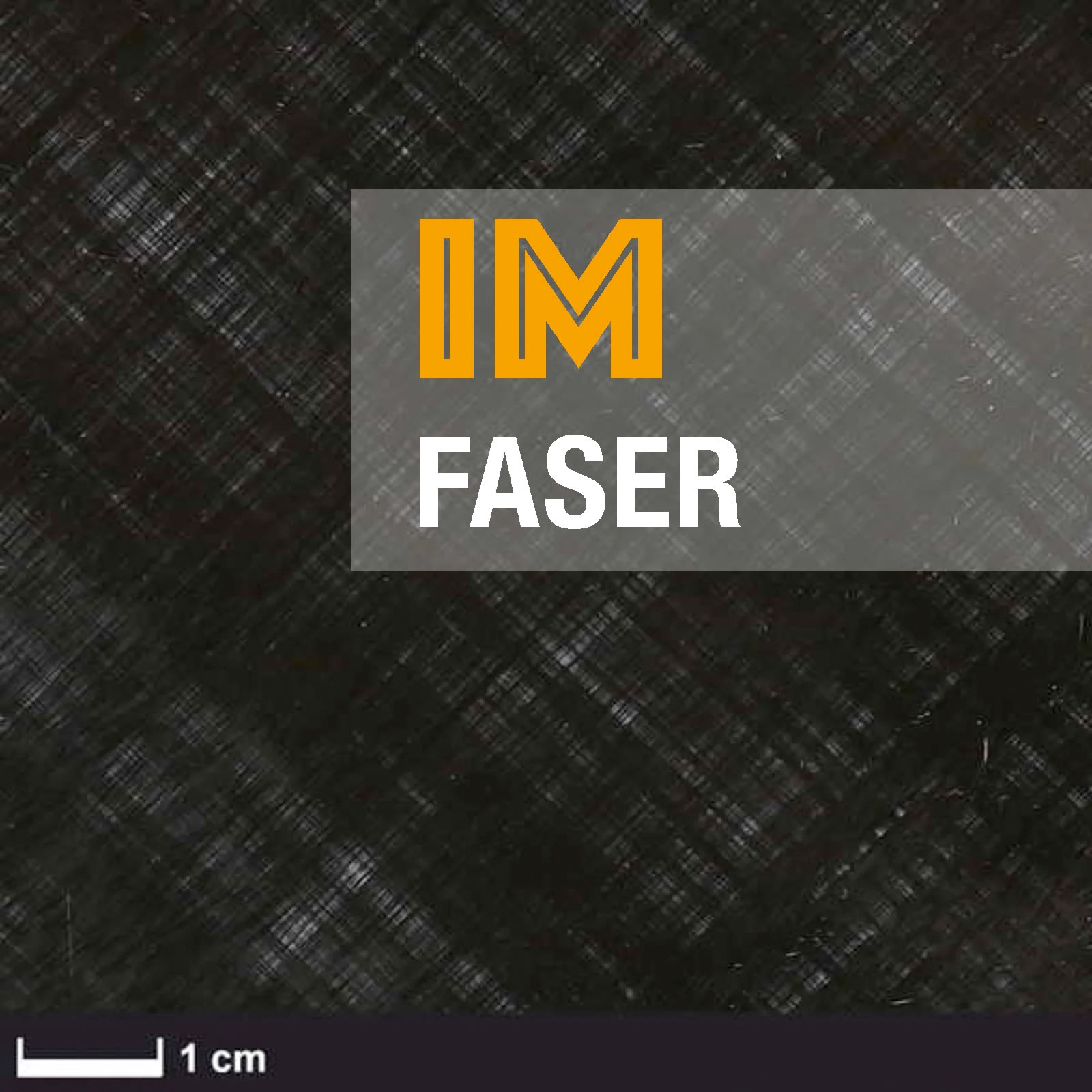 A roll of material with a black surface and a white edge, partially unrolled on a white background. It appears to be a type of sheeting or fabric.