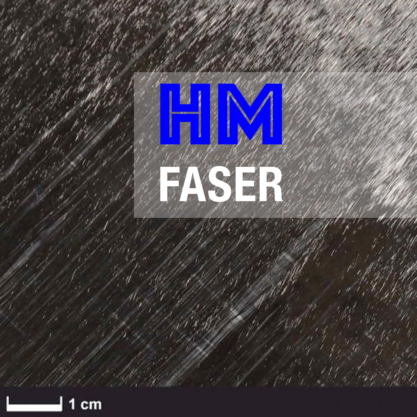 Ein schwarzes Materialstück mit weißem Rand und einer grauen Rolle oben.