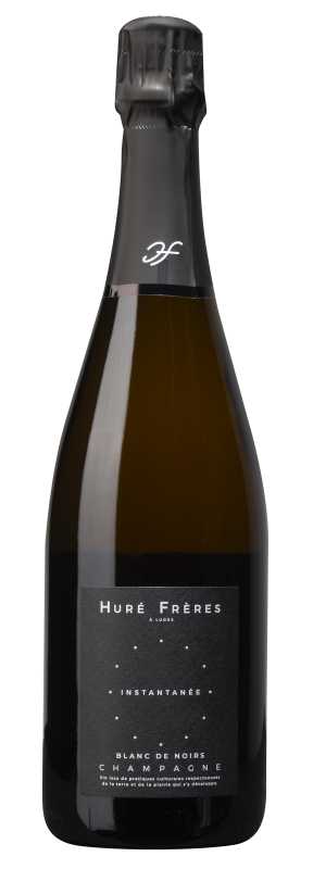 Produktfoto: Weinflasche mit schwarzem Etikett, Aufschrift Huré Frères, Champagner Blanc de Noirs, Instantanée.