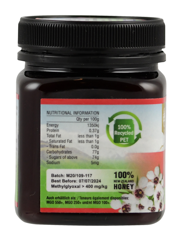 Produktfoto: Ein Glas Bio-Manuka-Honig der Marke TranzAlpine ist abgebildet. Das Etikett zeigt ein Bergmotiv und die Aufschrift 'Bio-Organic Manuka Honey MGO 400+ aus Neuseeland'. Der Honig ist in einem dunklen Glas mit schwarzem Deckel verpackt.