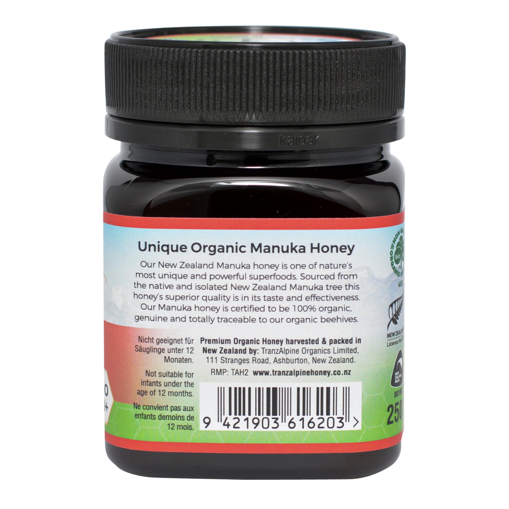 Produktfoto: Ein Glas Bio-Manuka-Honig der Marke TranzAlpine ist abgebildet. Das Etikett zeigt ein Bergmotiv und die Aufschrift 'Bio-Organic Manuka Honey MGO 400+ aus Neuseeland'. Der Honig ist in einem dunklen Glas mit schwarzem Deckel verpackt.