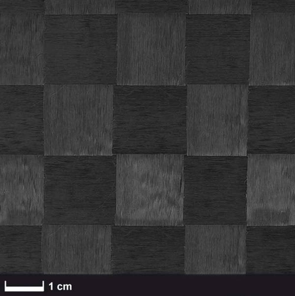 The image shows a black and gray checkerboard pattern with a scale indicating 1 cm. The texture appears to be wood or a similar material.