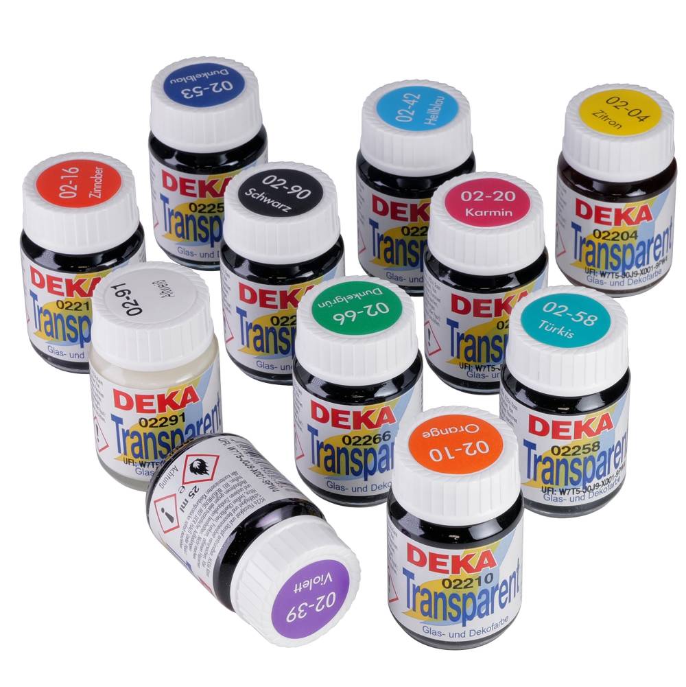 The image shows a collection of DEKA Transparent glass and porcelain paints in various colors. Each bottle has a colored lid indicating the paint color, with labels showing product details. The colors include red, blue, yellow, black, and more.