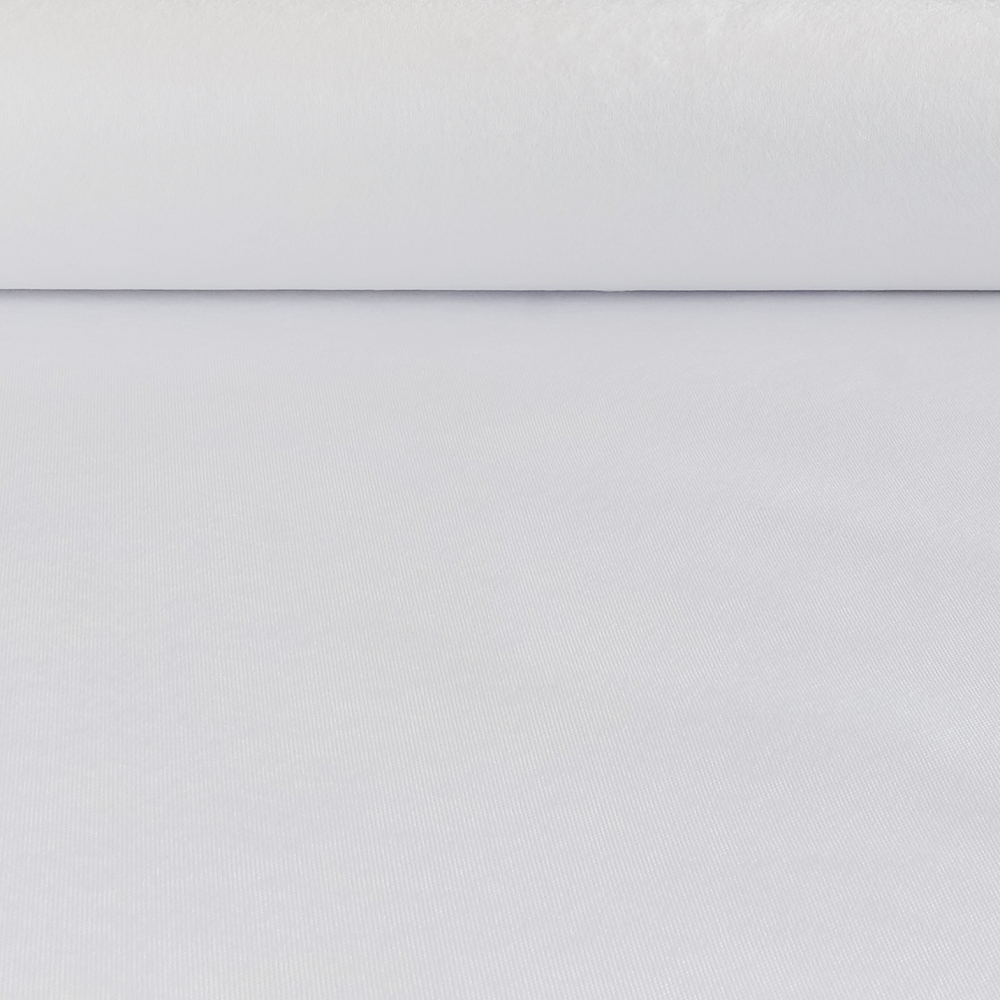 A close-up view of a white fleece on a flat surface.