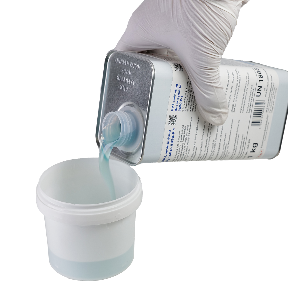 A hand wearing a glove is pouring a blue liquid from a metal container into a white plastic cup.