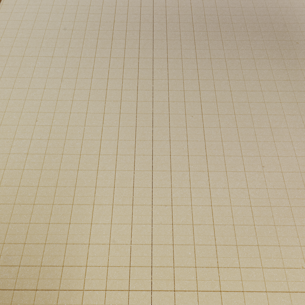 Ein Bild von einer beige karierten Oberfläche mit regelmäßigen quadratischen Mustern.