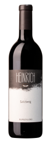 Produktfoto: Hochwertige Weinflasche mit schwarzem Etikett und der Aufschrift 'Heinrich Ried Salzberg Burgenland'.