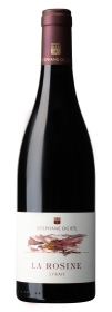 Produktfoto: Weinflasche mit Etikett 'La Rosine Syrah'. Dunkler Flaschenhals mit goldener Schrift.
