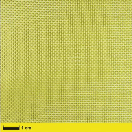 Nahaufnahme eines gelben, gewebten Materials mit einem Maßstab von 1 cm am unteren Rand.