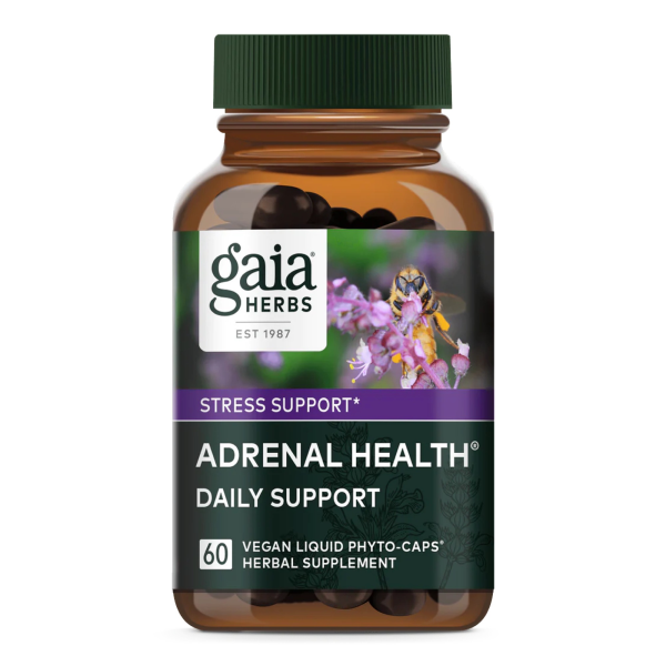 Produktfoto: Das Bild zeigt eine braune Flasche mit einem grünen Deckel. Auf dem Etikett steht 'gaia HERBS', 'STRESS SUPPORT', und 'ADRENAL HEALTH DAILY SUPPORT'. Es sind 60 vegane Flüssigkapseln enthalten. Im Hintergrund ist eine Biene auf einer lila Blume abgebildet.