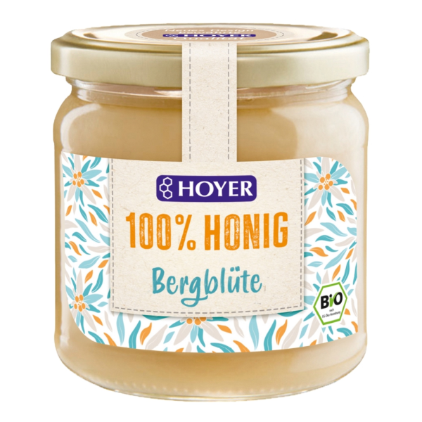 Produktfoto: Glas mit Hoyer 100% Honig Bergblüte, Bio-Qualität, florales Etikettendesign.